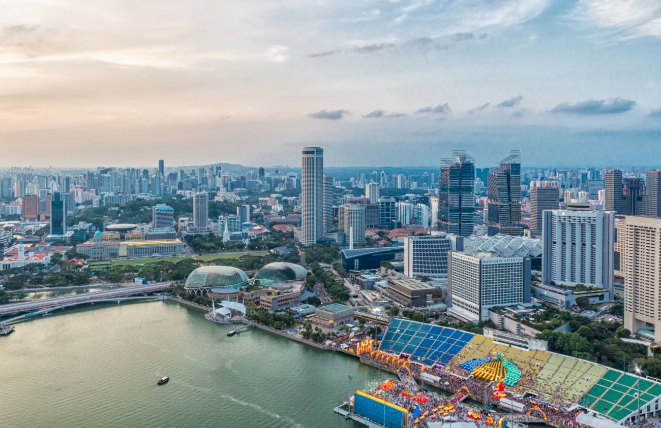 Panoramic view of Singapore city skyline featuring a modern stadium, symbolizing global financial and banking hub.