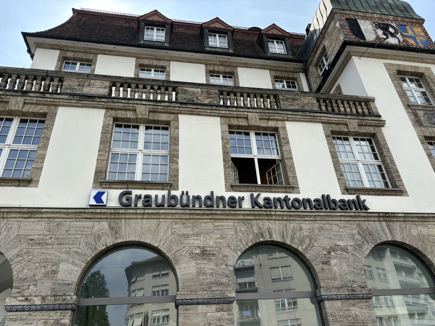 Historic Graubündner Kantonalbank facade in Switzerland for clients looking to open a Swiss bank account as non-resident