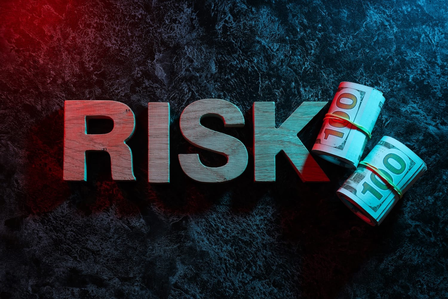 High-risk industries banking concept with money rolls and risk lettering illustrating how to get banked for high-risk businesses