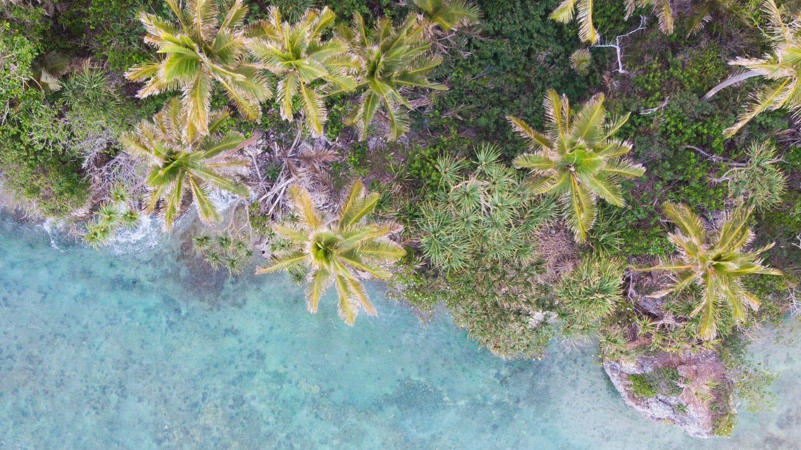 Correspondent banking cutoff: aerial view of Vanuatu’s coastline, cut off from Australian dollar clearing in 2025